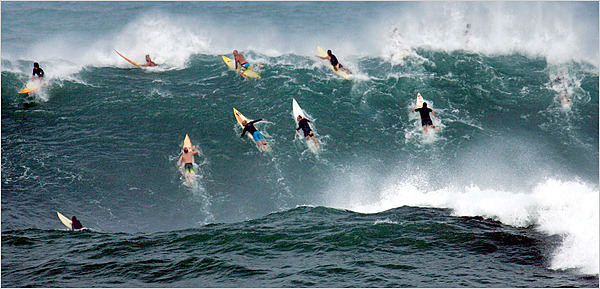 Surfers Paddling